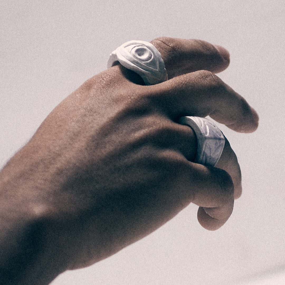 hand with white bonded marble eye ring