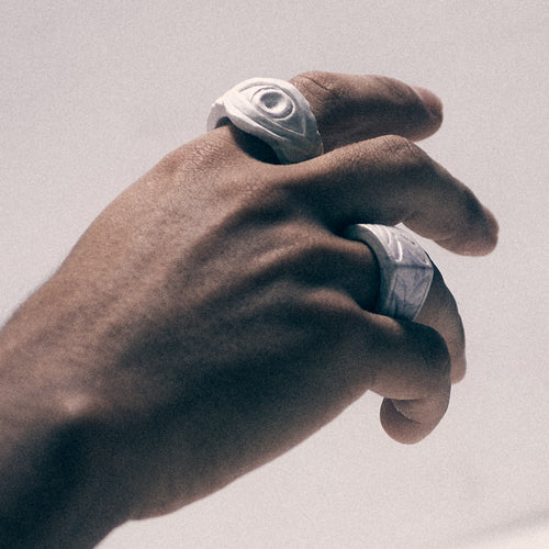 hand with white bonded marble eye ring