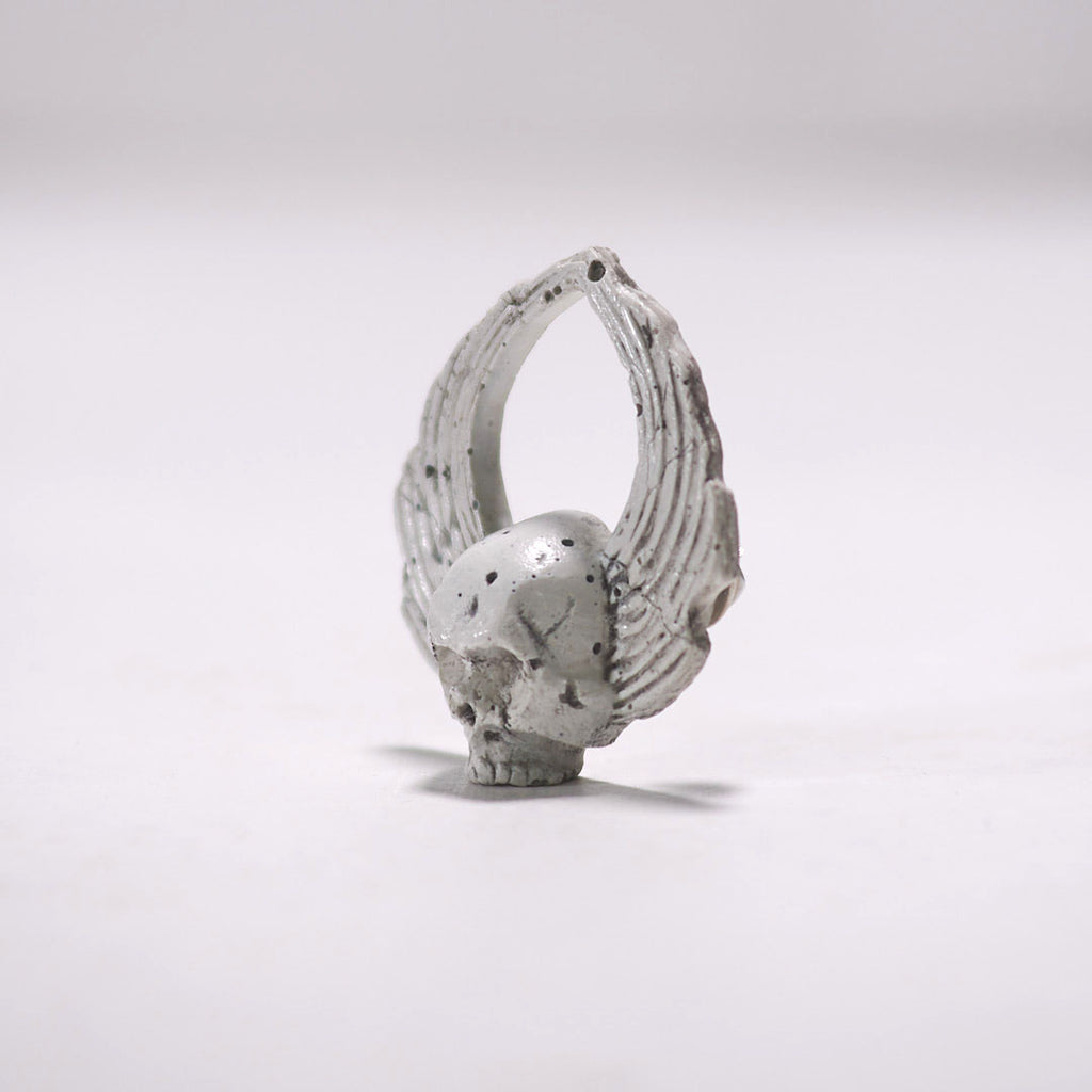mini sculpture winged skull pin