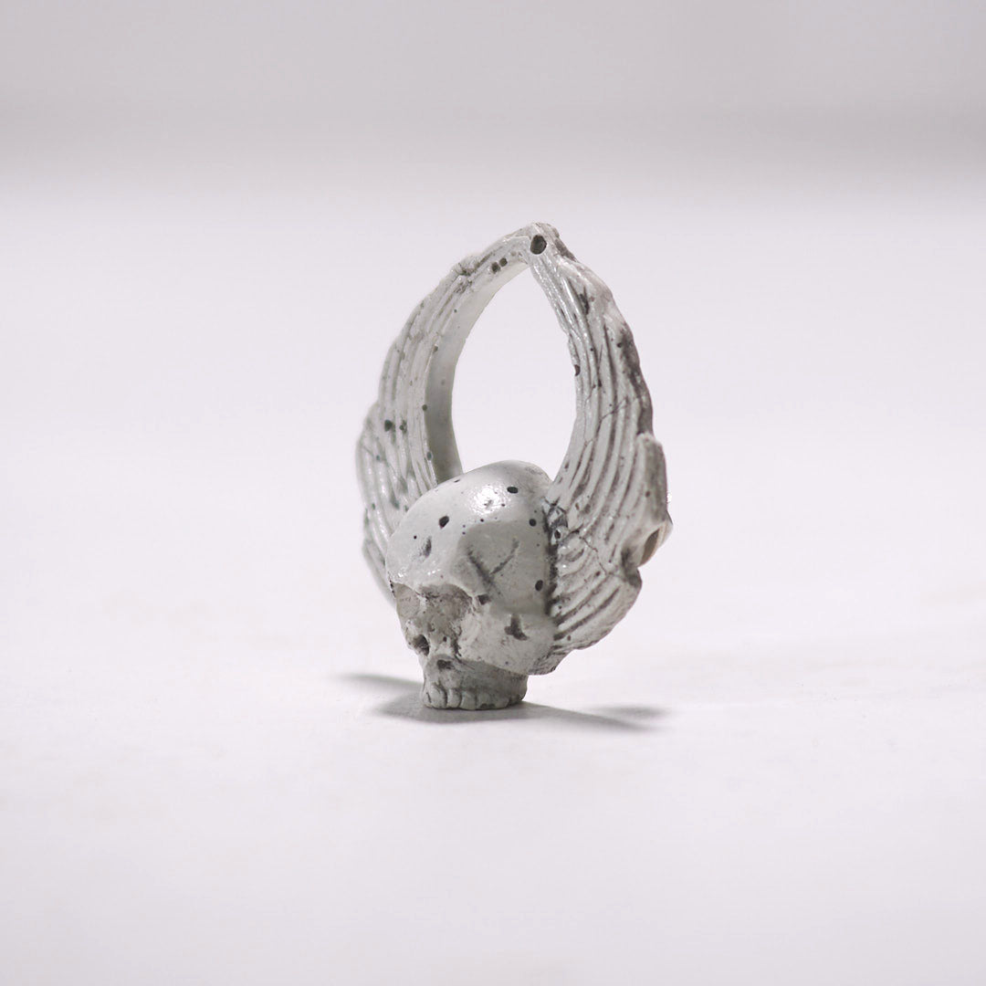 mini sculpture winged skull pin